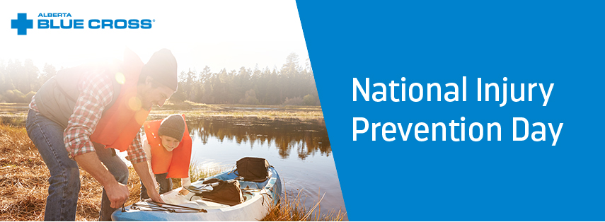 An image of a father and son in life vests, about to put a kayak in a lake. The Alberta Blue Cross logo is in the top left corner and the right hand side of the image has a blue background with National Injury Prevention Day typed in white.