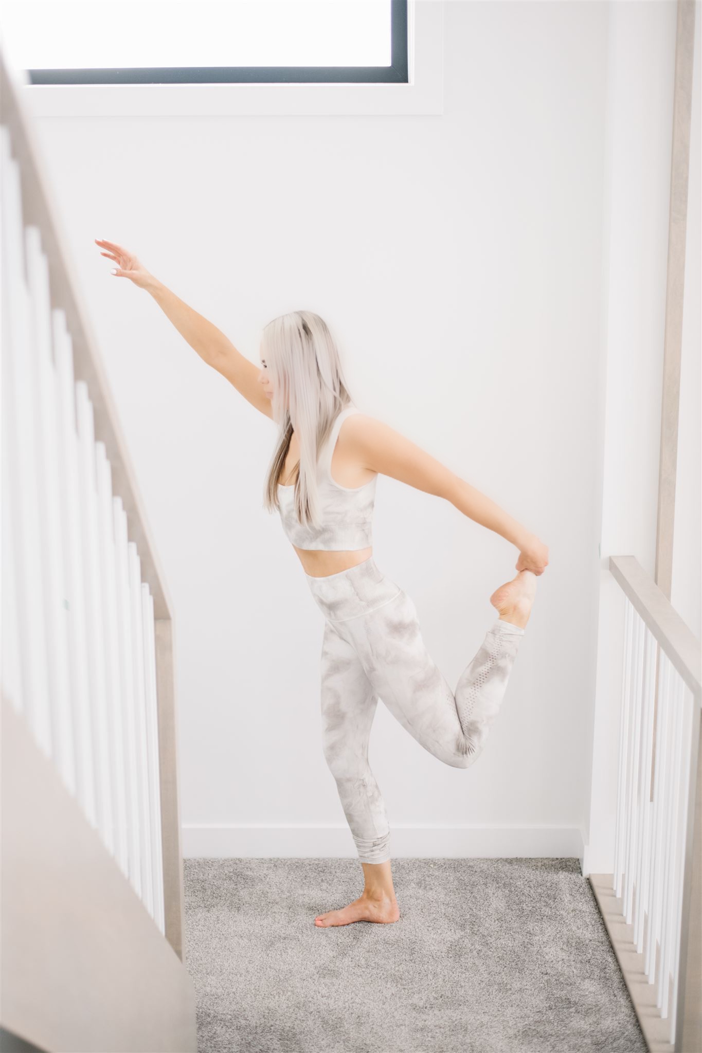 Richelle doing yoga in her stairwell