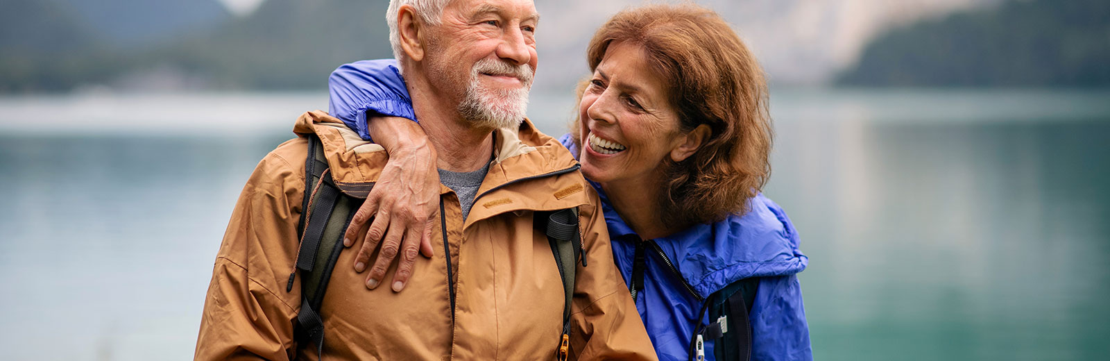 Retiree couple laughing while on vacation