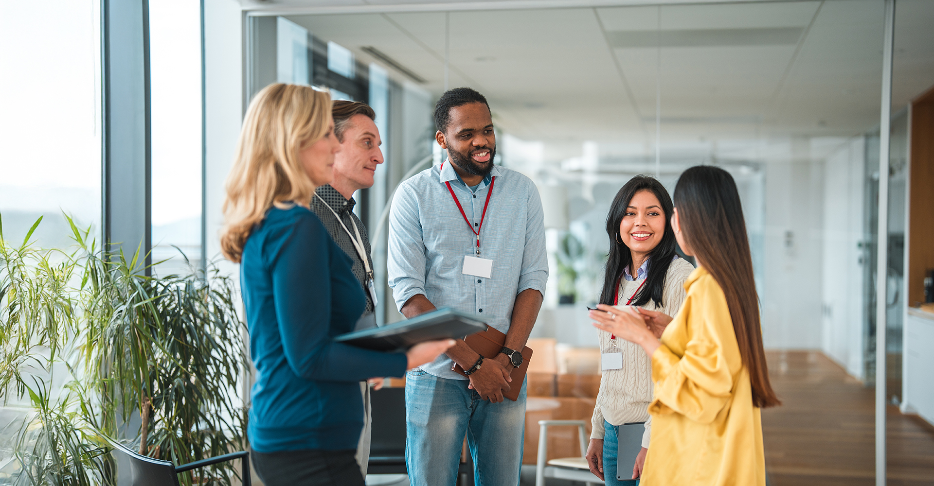 A diverse group of employees collaborating in a modern office setting.